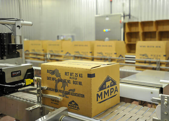 View of the MMPA butter plant production line showcasing boxes packaged with butter