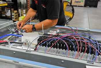 Shambaugh team member preassembling materials in their prefabrication facility