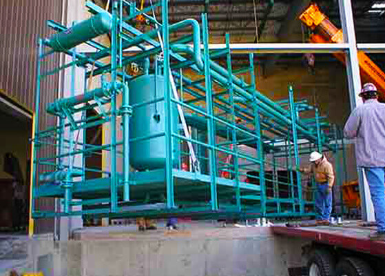 Ammonia refrigeration equipment being installed at AmericQual Foods