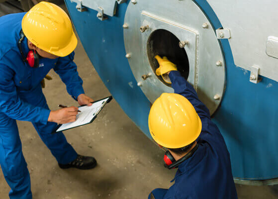 Team members utilizing the new coal and limestone fired boiler units at a utility plant