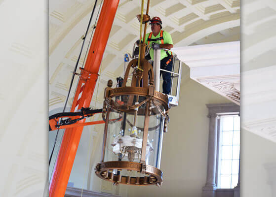 Shambaugh team member on a lift working close to ceiling