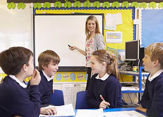 Elementary students sitting in a classroom setting