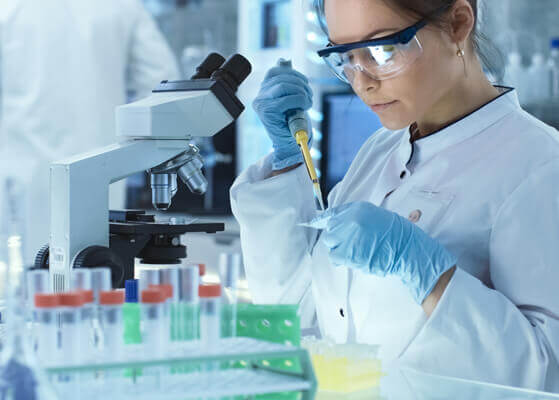 Scientist working in laboratory facility